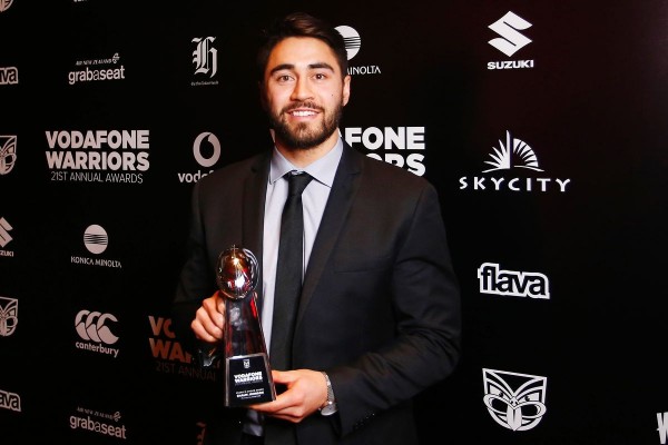 Vodafone Warriors halfback Shaun Johnson holding award