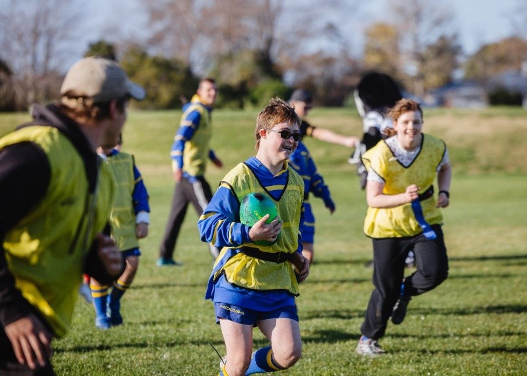 A group of rangitahi playing rippa rugby