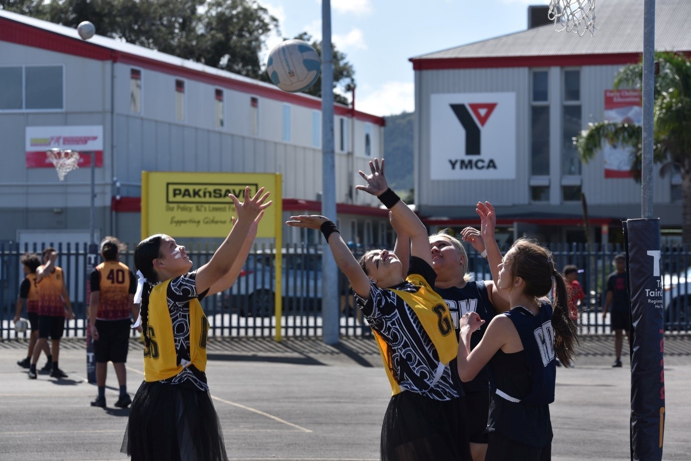 Young women playing netball