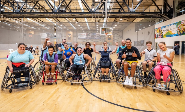 Group of wheelchair participants in a basktball gym