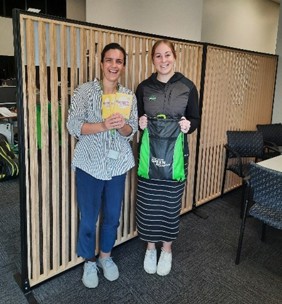 2 women with play packs for those moving in Kāinga Ora homes