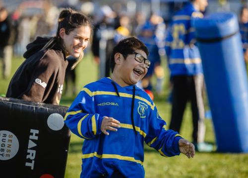 A yound disabled boy enjoying a day of play