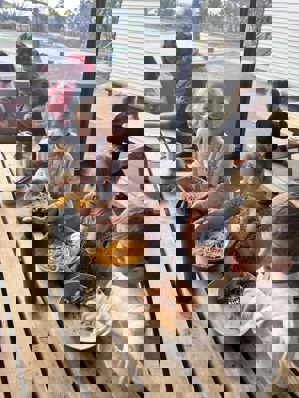 young kids eating spaghetti