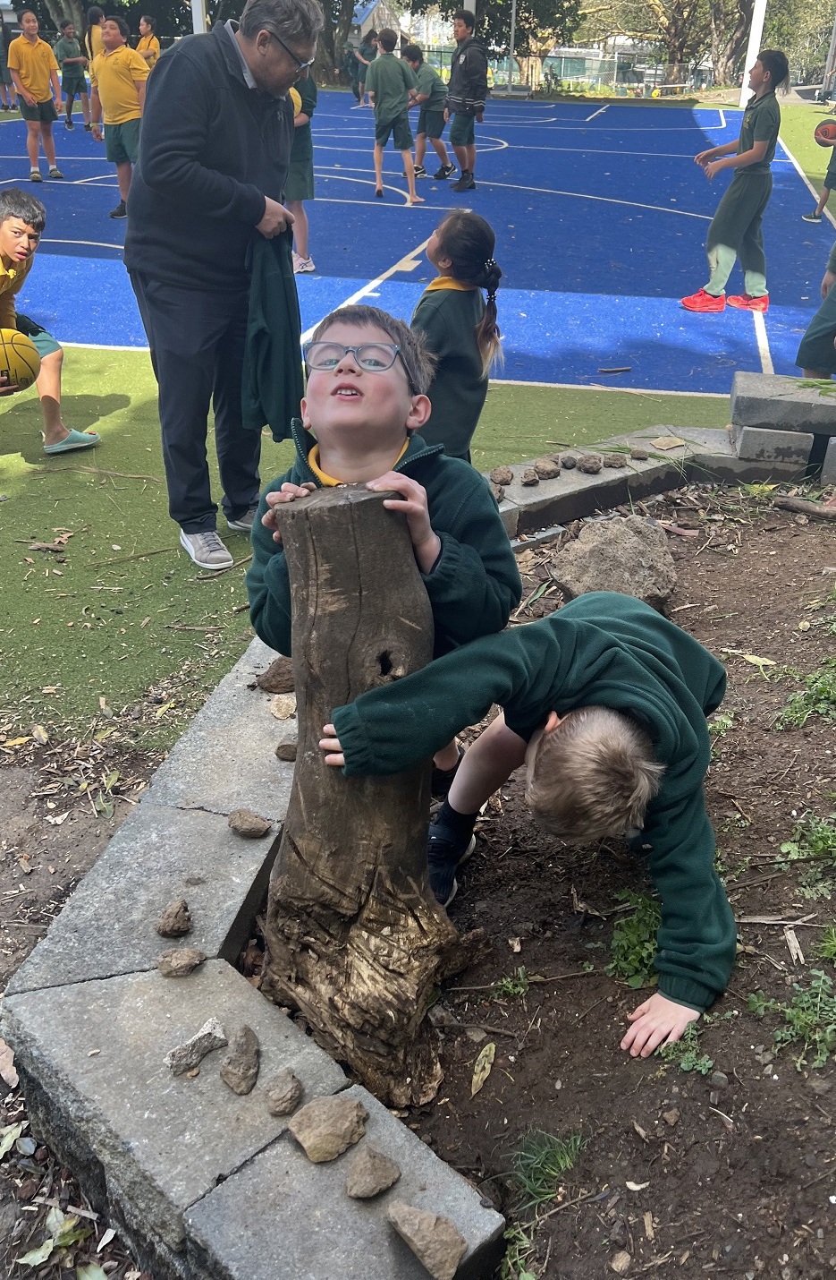 Tamariki playing in mud
