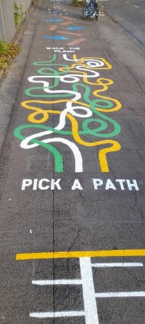 Twisted paths drawn on footpath to make walking fun