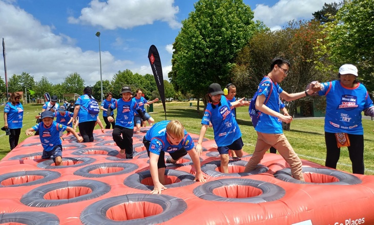Tamariki playing on an obstacle course