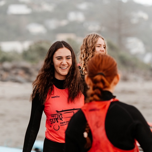Three young women on a beach
