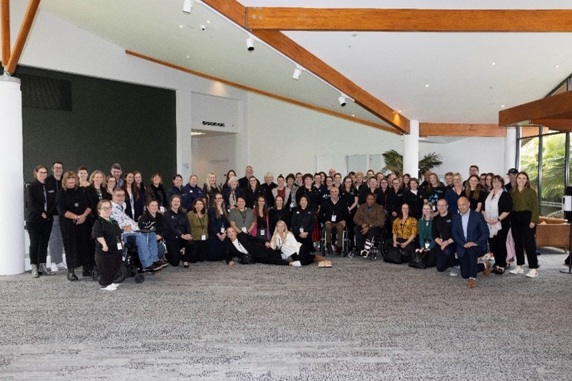 Group of people looking to camera at the disability hui