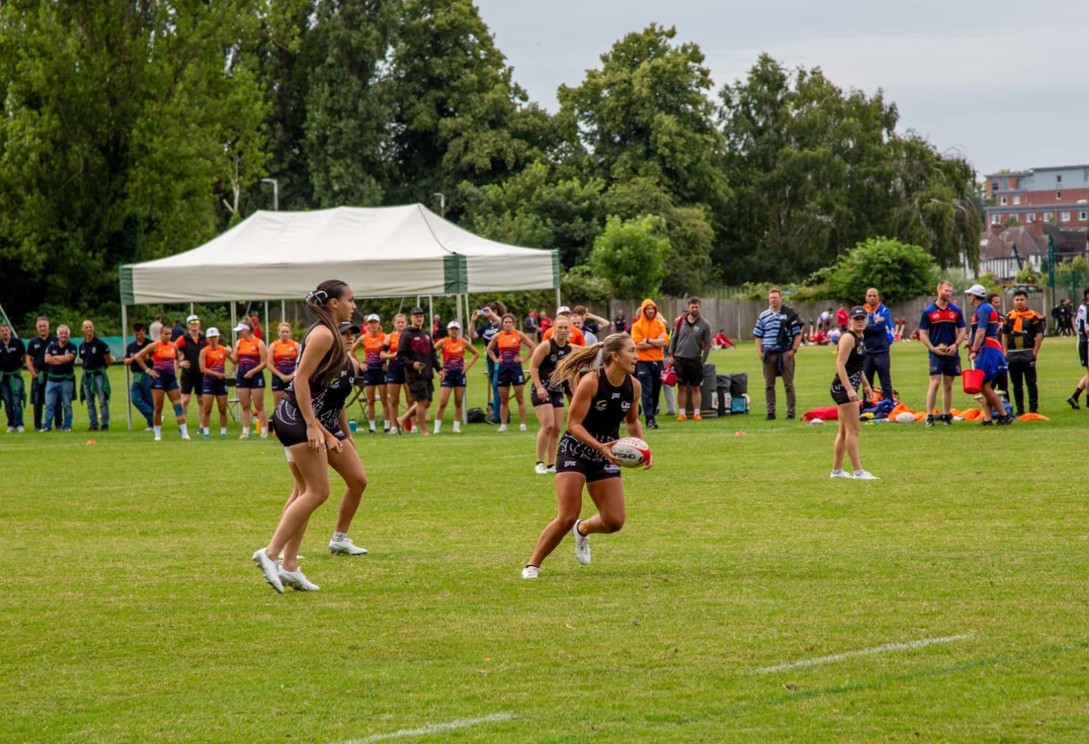 Women playing touch rugby