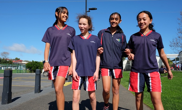 Group of young women walking outside for a PE class